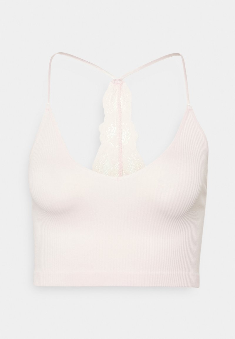 Soutien-gorge côtelé rose clair avec un dos nageur en dentelle festonnée et des fines bretelles réglables.