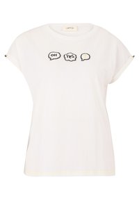 T-shirt blanc à manches courtes avec des poignets retroussés, ornée de bulles de dialogue brodées avec "OH", "OUI", et un accent jaune à l'intérieur de la dernière bulle.