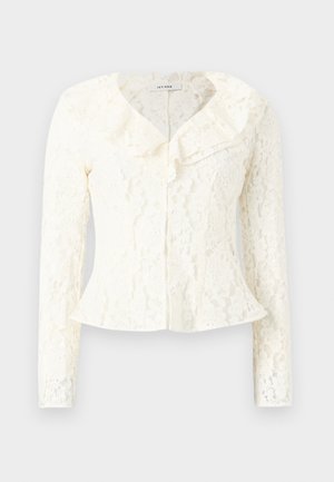 Bela čipkasta bluza z dolgimi rokavi, z volančkastim izrezom in gumbi spredaj, s cvetličnim vzorcem in oprijetim pasom.