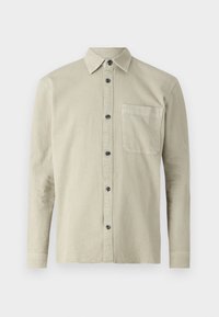 Cămașă cu mânecă lungă, butonată, dintr-un material bej deschis. Are un guler ascuțit, un buzunar pe piept și butoane negre. Design simplu, texturat.