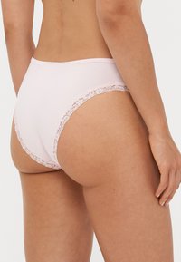 Pink cotton brief with a smooth finish, lace trim along the waistband and leg openings, featuring a high-cut design and full coverage at the back.
