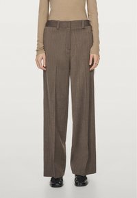 Brown, wide-leg trousers with vertical stripes, featuring a flat front, belt loops, and a tailored fit. Made from textured fabric.