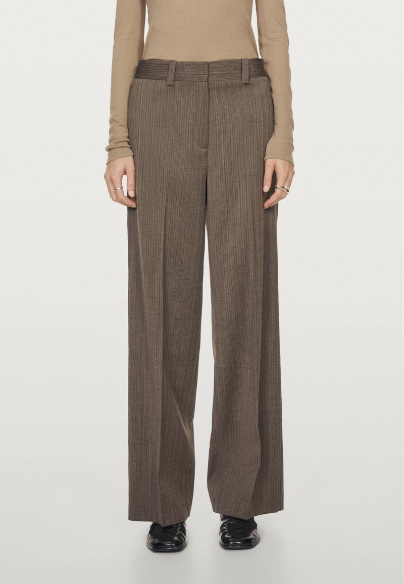 Brown, wide-leg trousers with vertical stripes, featuring a flat front, belt loops, and a tailored fit. Made from textured fabric.