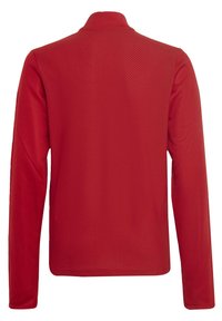 Chemise rouge à manches longues avec un motif texturé en losanges. Présente un col montant et un ourlet arrondi. Tissu doux et extensible pour le confort.