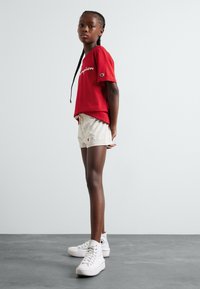 Champion ICONS WITH LARGE LOGO UNISEX - Tracksuit bottoms - sand