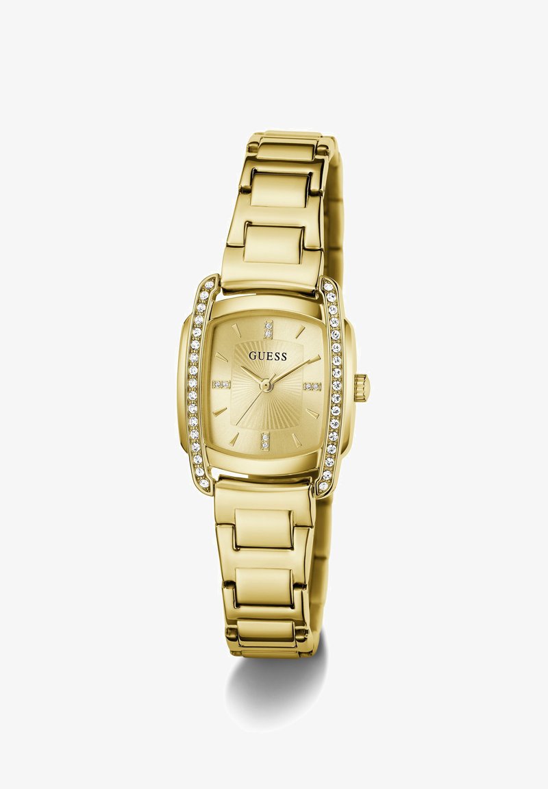 Montre-bracelet Guess ton or avec cadran rectangulaire, accents en cristal sur les côtés et index simples sur un cadran métallique.