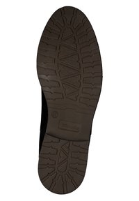 Semelle de chaussure en caoutchouc noir avec un motif de semelle texturé, présentant des rainures et des crêtes profondes pour l'adhérence. Inclut le logo de la marque dans la zone du talon.