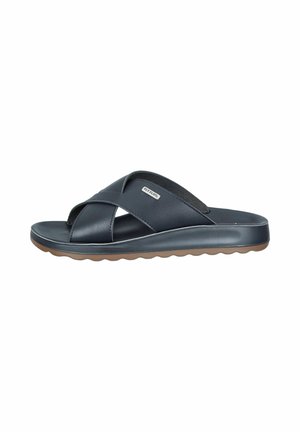 Men's black leather slip-on sandal with crossed straps and brown rubber sole, branded with a small metal Fly Flot logo.