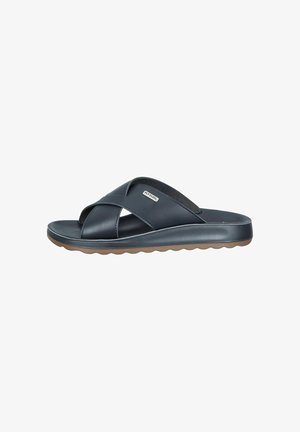 Men's black leather slip-on sandal with crossed straps and brown rubber sole, branded with a small metal Fly Flot logo.