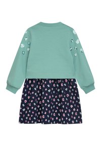 Mintgrüner Sweatshirt-Oberteil mit langen Ärmeln, verziert mit dekorativen Punkten. Angesetzter marineblauer Rock mit einem mehrfarbigen Blumendruck.