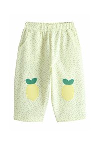 Gulgröna shorts med resår i midjan, med två citronapplikationer och ett prickigt mönster i grönt. Tillverkade av ett mjukt, lätt tyg.