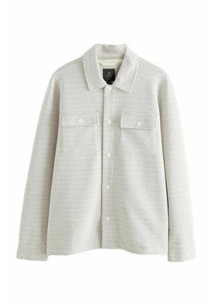 Light gray textured shirt jacket with a pointed collar, two chest pockets, snap buttons, and a relaxed fit. Made from woven fabric.