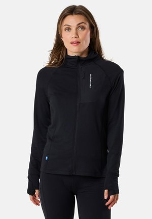 Black zip-up jacket with high collar, fitted design, and thumbholes. Features a zippered chest pocket. Made from soft, stretchy material.