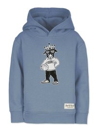 Harmaan sininen huppari, jossa on grafiikka koirasta kruunu ja aurinkolasit päässään, pitelemässä koripalloa. Hupparissa on yksityiskohtana "G.O.A.T." -teksti ja hihansuut.