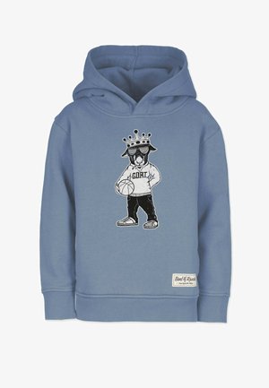 Grå-blå hættetrøje med et tryk af en hund i en krone og solbriller, der holder en basketball, detaljeret med "G.O.A.T." tekst og manchetter.