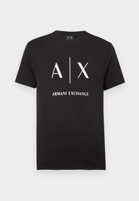 Svart bomulls-t-skjorte med initialene "A|X" og "ARMANI EXCHANGE" trykt i hvitt. Rund hals og korte ermer.