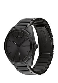 Orologio da polso in acciaio inox nero di Calvin Klein con quadrante analogico, caratterizzato da una lunetta decorata, indicazione del giorno e una finestra rettangolare per la data.
