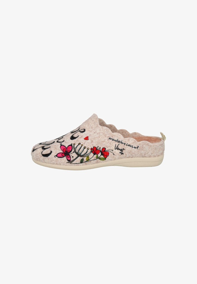 Zapatilla deslizante beige con bordes ondulados, que presenta un bordado floral colorido y texto en cursiva en el lateral y la parte superior.
