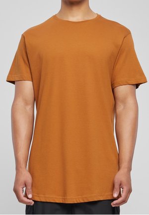 Brun bomulds t-shirt med korte ærmer og rund halsudskæring. Har en lige kant og en glat tekstur. Ingen mønstre eller grafik til stede.