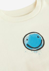 Next PRINTED  - Collegepaita - ecru white smile