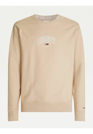 Beige lange mouwen trui met ronde hals, met "Tommy Jeans" tekst en logo geborduurd op de borst en een klein logo op de manchetten.