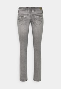 Slim-fit grey denim jeans with back pockets featuring stitched wave designs and belt loops, shown from the rear.
