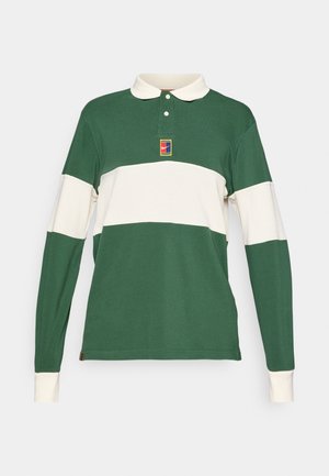 Zeleno dolg rokav polo majica z belimi vodoravnimi črtami. Ima ovratnik in majhen logotip na prsih. Iz bombažnega materiala, z rebrastimi manšeti.