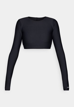 Black crop top with long sleeves, made of smooth, stretchy material. Features a round neckline and a minimalistic design with a straight hem.
