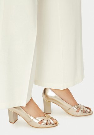 Lahtise ninaga kontsakingad - golden