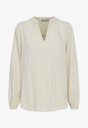 Cremefarvet bluse med V-hals, lange ærmer med samlede manchetter og et struktureret mønster over det hele. Blødt, let stof.