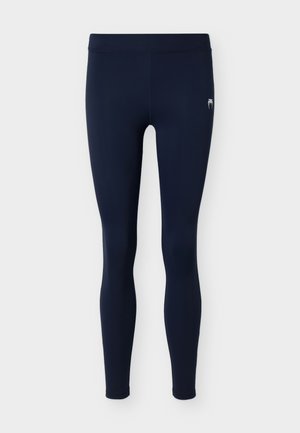 Leggings pour femmes bleu marine longueur totale avec taille élastique et petit logo blanc sur la cuisse supérieure.