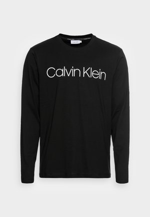 Chemise noire à manches longues avec logo Calvin Klein blanc imprimé sur la poitrine et col rond.