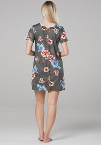 Floral short-sleeve dress in gray with blue and red flowers. Features a back button closure and a relaxed fit. Smooth fabric texture.