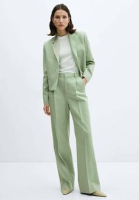 Mango Pantaloni - light green
