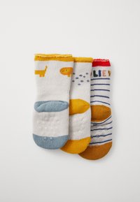 Drei Paare Kindersocken: verspielte Designs mit einer Katze und einem Löwen, einfarbige Farben, gestreifte Muster und rutschfeste Gummidots an den Sohlen.