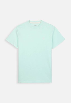 T-shirt en coton vert menthe avec un col rond et des manches courtes. Présente un petit logo sur la poitrine et une texture lisse.