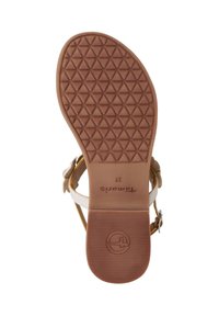 Suola di sandali in gomma marrone con un motivo a diamante. Presenta cinturini regolabili in pelle bianca e un logo circolare. Taglia 37 indicata sulla soletta.