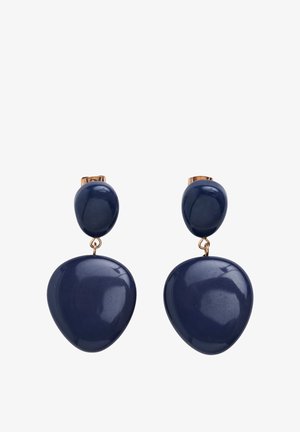 Laivastonsiniset, suurikokoiset keramiikkakorvakorut, joissa on kiiltävä pinta. Korvakorujen yläosassa on pyöreä muoto ja alaosassa pisaran muotoinen, jotka on yhdistetty kullanvärisellä lenkillä.