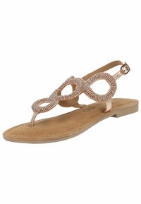 Sandalo piatto rosa con un design decorativo di perline, cinturino alla caviglia regolabile e soletta in morbido camoscio. Presenta uno stile minimalista a fascia.