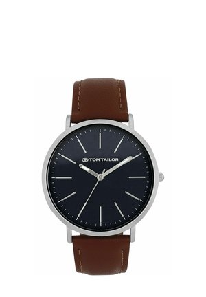 Round silver wristwatch with black dial, minimalist white hour markers, Tom Tailor logo, and brown leather strap.
