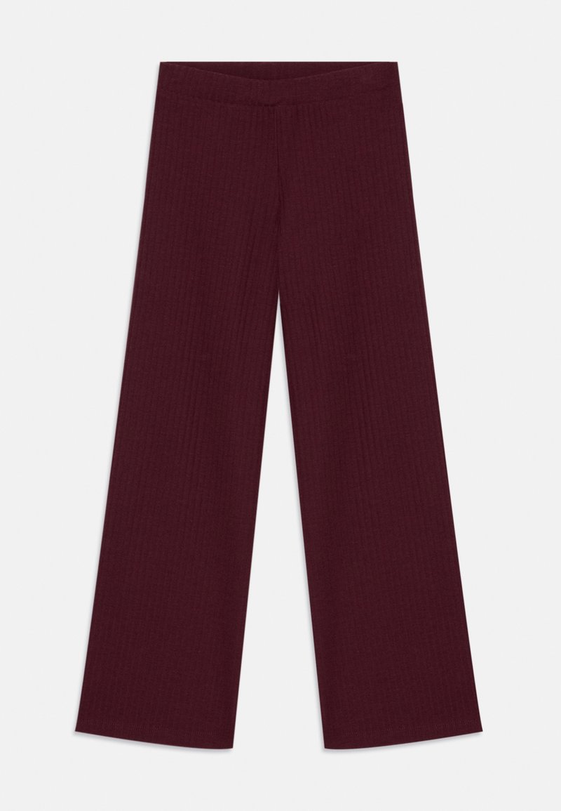 Platas kāju, ribota adījuma bikses tumši burgundijas krāsā ar piegulīgu jostu, izliktas pret vienkrāsainu gaišu fonu.