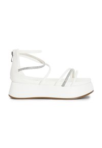 White platform sandals with multiple straps, featuring silver accents, a smooth texture, and a rear zipper for easy wear.