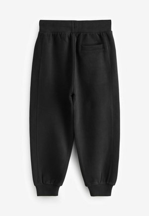 Pantalones de chándal negros hechos de tela suave, con una cinturilla acanalada, puños ajustados y un pequeño bolsillo en la parte posterior.