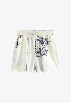 Hvide korte shorts med elastisk talje med marineblåt abstrakt blomster- og gittermønster, med snøre foran.