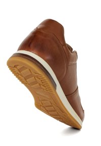 Brown leather sneaker with perforated side, molded rubber sole, and white midsole. Curved shape with contrast stitching details.