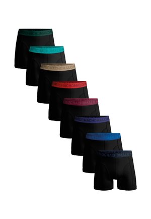 Boxers noirs alignés, présentant des ceintures élastiques colorées en turquoise, beige, rouge, rose et bleu avec la marque "MUCHACHOMALO".