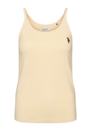 Bēškrāsas rievota bezroku tanktopi ar apaļu izgriezumu, neliela izšūta polo spēlētāja logo kreisajā krūtīs un U.S. Polo Assn. etiķete apkakles iekšpusē.