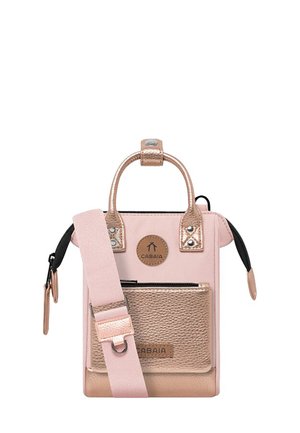 Small handbag with pink fabric, metallic pink accents, and a textured bronze front pocket. Features a top handle and removable strap.