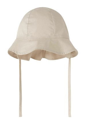 Beiger Baumwoll-Bucket-Hut mit breiter Krempe und langen Kinnriemen, entworfen für Sonnenschutz und sicheren Sitz.