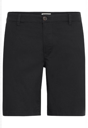 Mustem põlvpüksid nuppude kinnitusega, vöökummide ja esitaskutega, esitatud valge tausta ees.